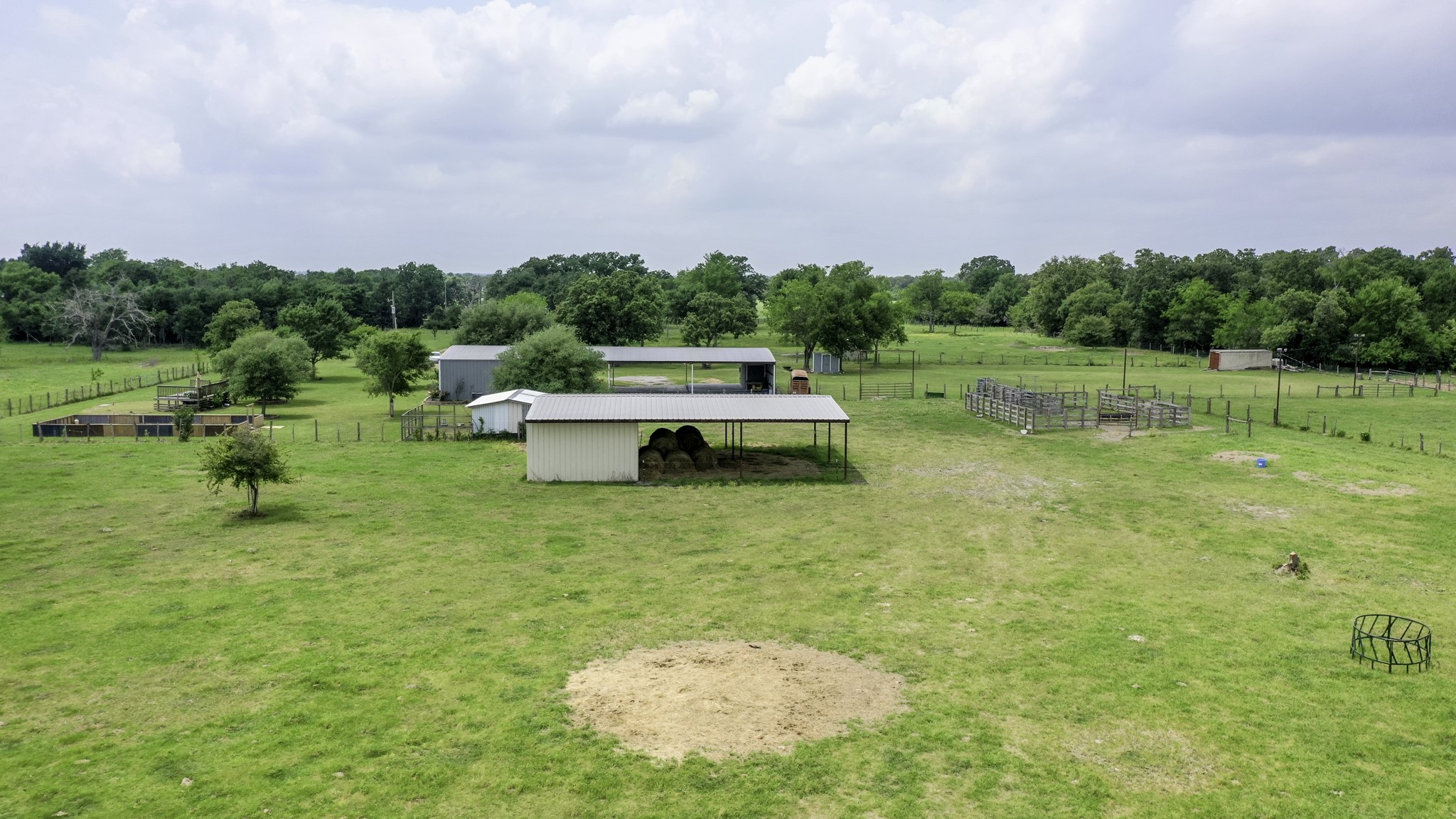 2266 Dutton Lane Madisonville, TX 77864 - Photo 33 of 50 a backyard of a house with table and chairs