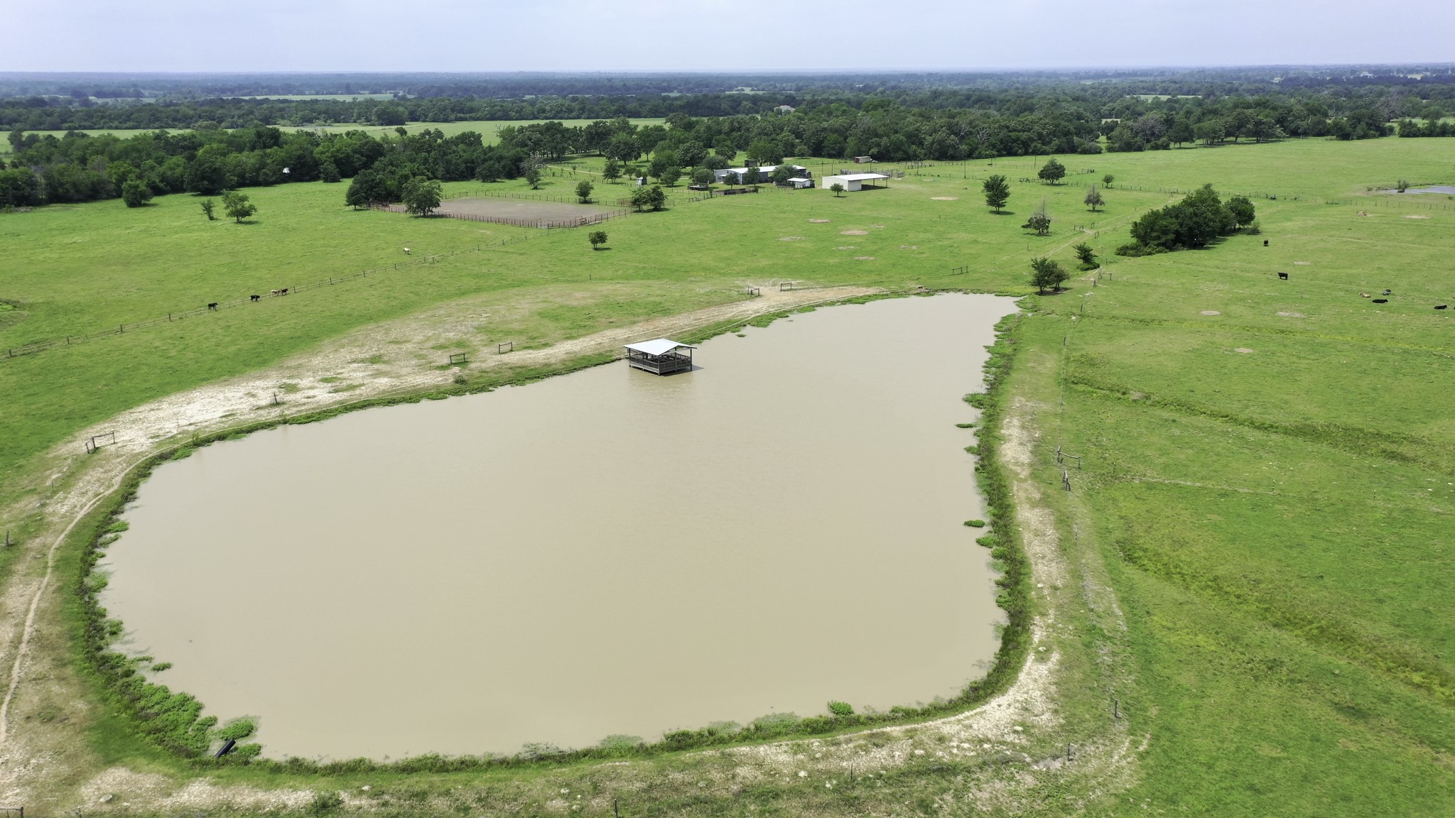 2266 Dutton Lane Madisonville, TX 77864 - Photo 43 of 50 an aerial view of a golf course with a yard