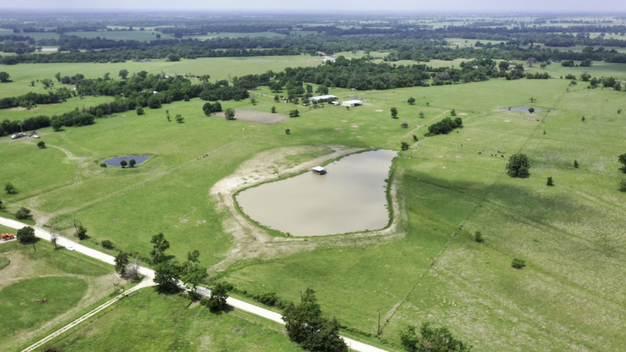 2266 Dutton Lane Madisonville, TX 77864 - Photo 49 of 50 an aerial view of a house with a yard