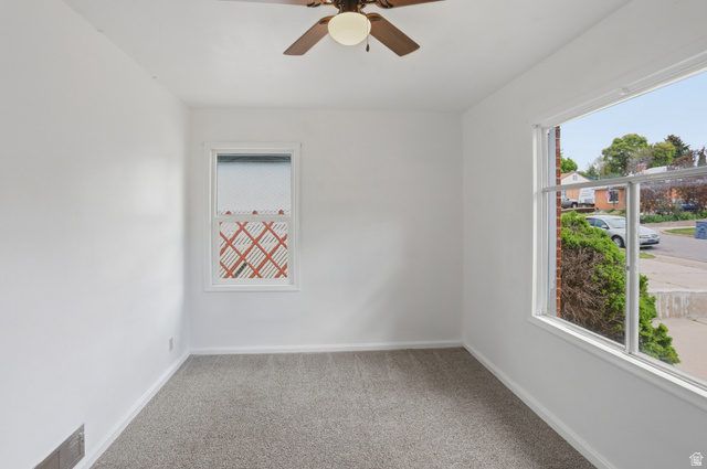 774 37th Street South Ogden, UT 84403 - Photo 14 of 47 Room featuring neutral carpeting, white painted walls, and a ceiling fan with integrated lighting