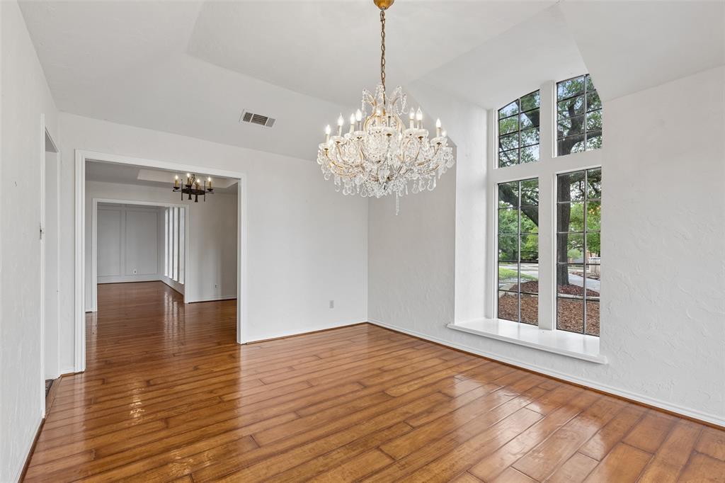 4 Eastshore Road Heath, TX 75032 - Photo 11 of 37 a view of livingroom with chandelier and wooden floor