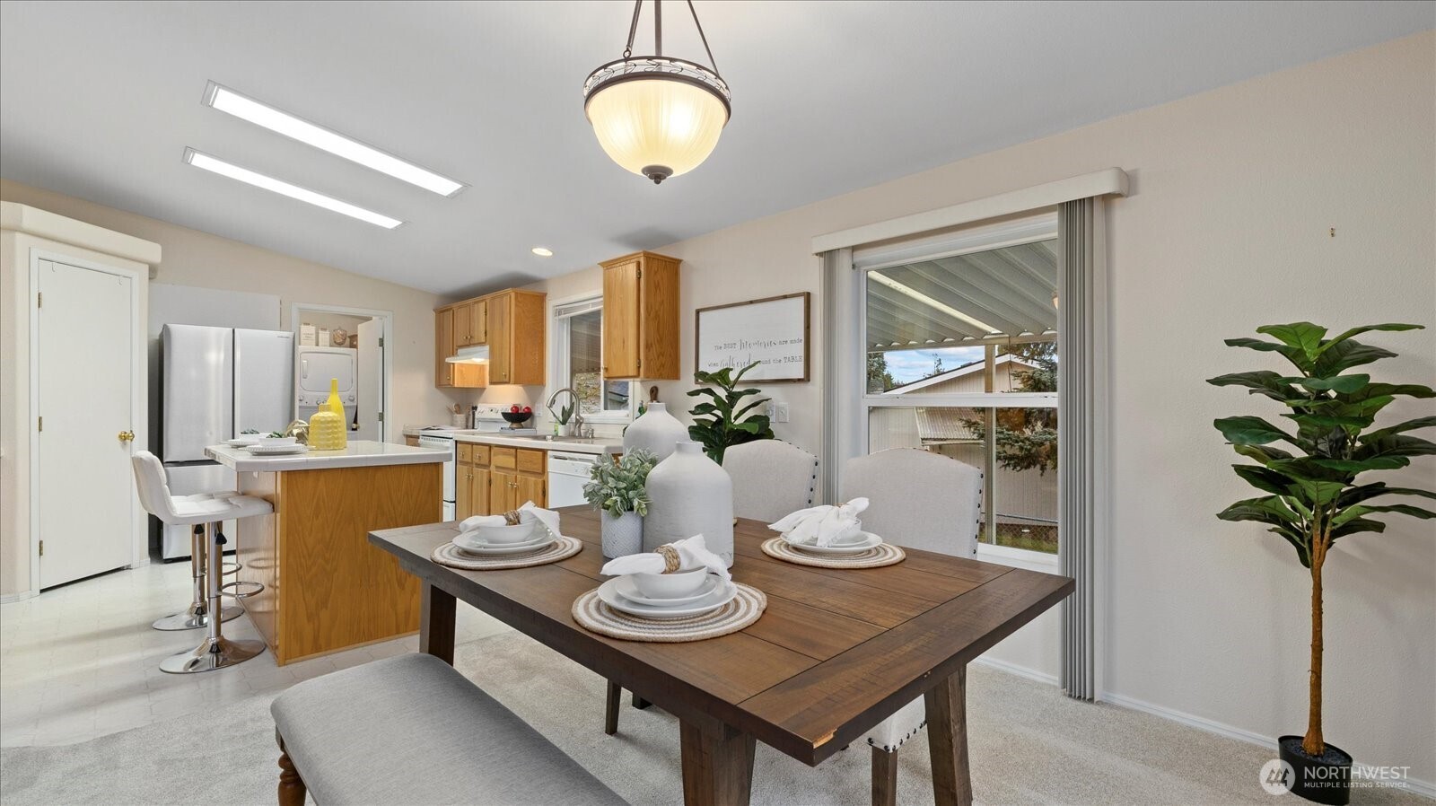23825 15th Avenue Southeast, Unit 1 Bothell, WA 98021 - Photo 12 of 25 a view of a dining room with furniture and a potted plant