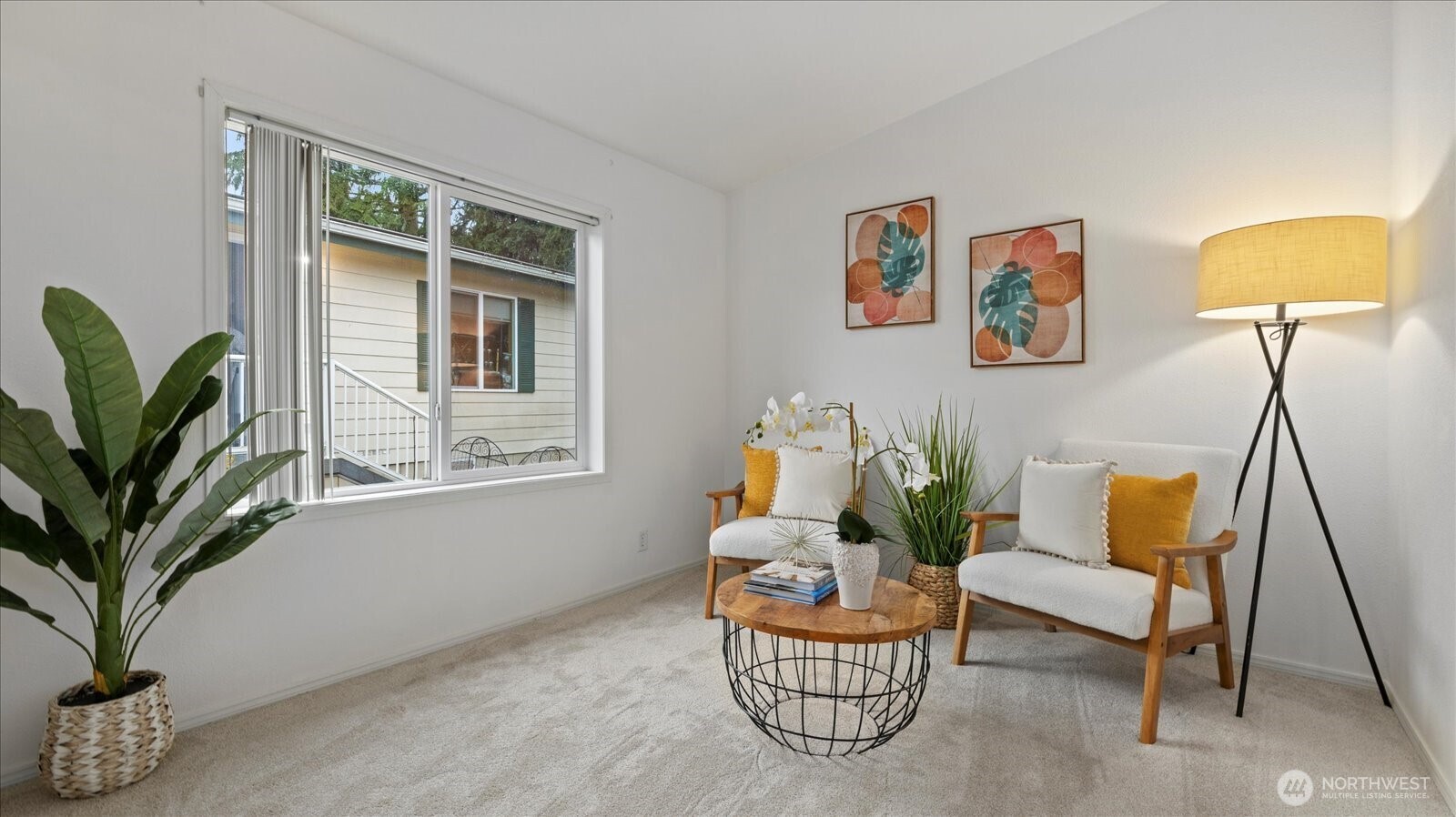 23825 15th Avenue Southeast, Unit 1 Bothell, WA 98021 - Photo 14 of 25 a living room with furniture and a potted plant