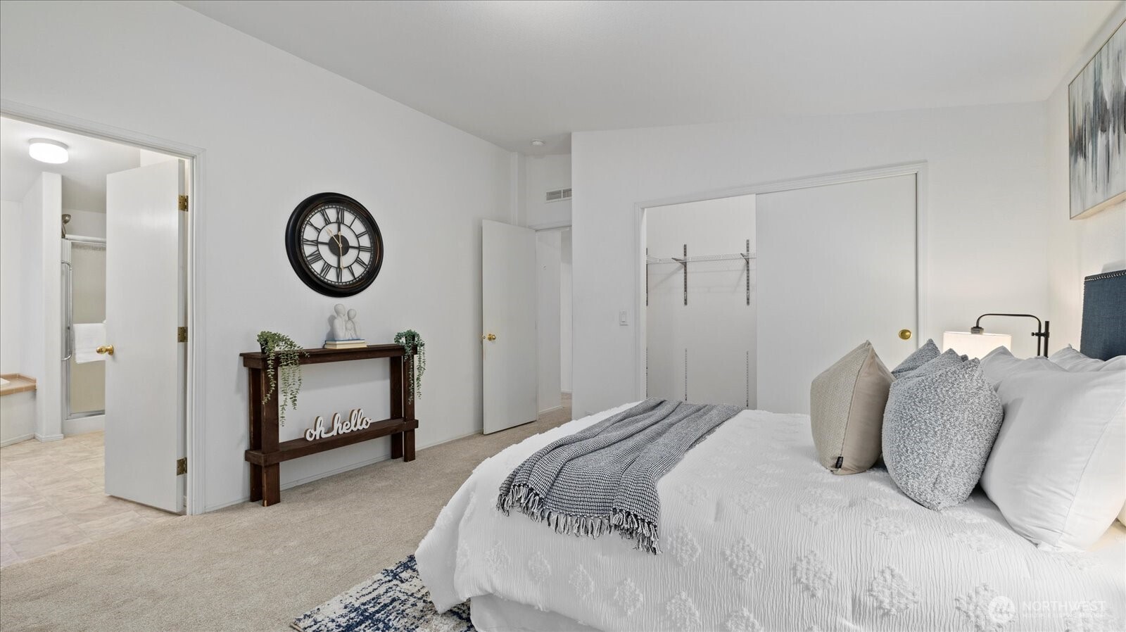 23825 15th Avenue Southeast, Unit 1 Bothell, WA 98021 - Photo 15 of 25 a bedroom with a bed and a wall painting