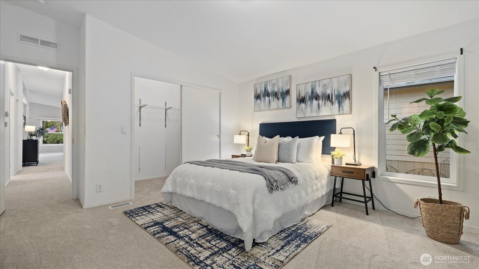 23825 15th Avenue Southeast, Unit 1 Bothell, WA 98021 - Photo 17 of 25 a spacious bedroom with a bed and a potted plant