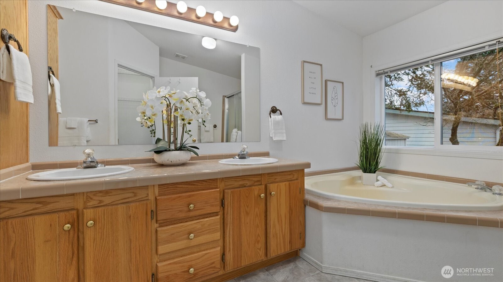 23825 15th Avenue Southeast, Unit 1 Bothell, WA 98021 - Photo 18 of 25 a bathroom with a double vanity sink and a mirror