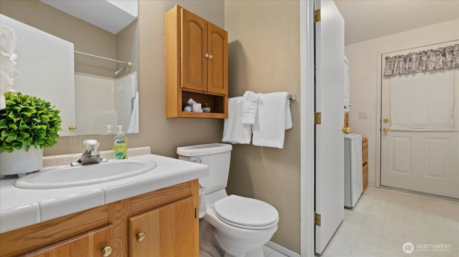 23825 15th Avenue Southeast, Unit 1 Bothell, WA 98021 - Photo 23 of 25 a bathroom with a sink toilet and shower