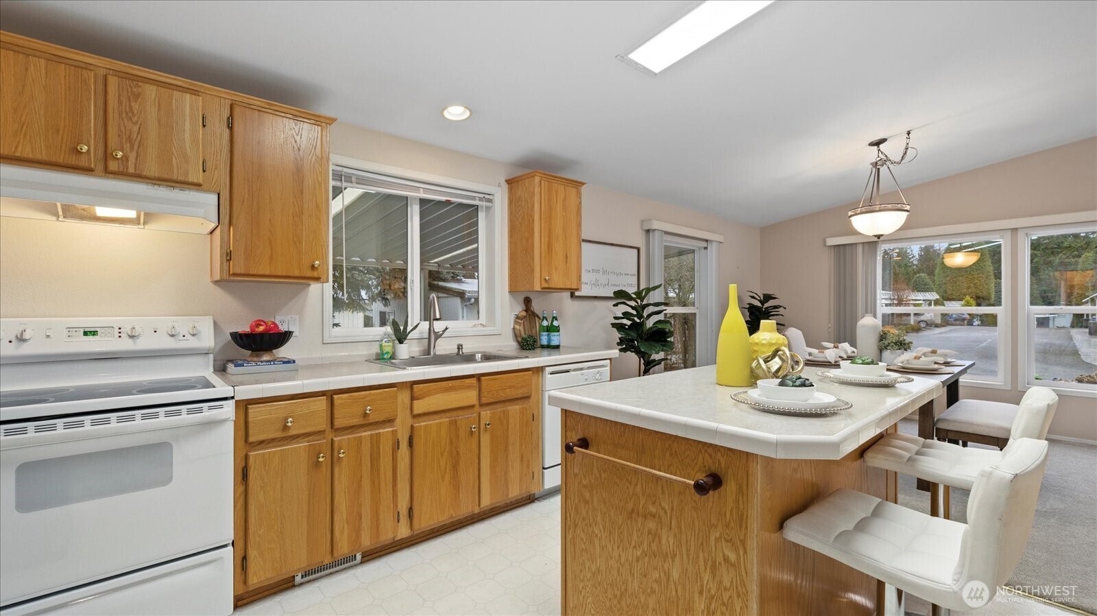 23825 15th Avenue Southeast, Unit 1 Bothell, WA 98021 - Photo 3 of 25 a kitchen with a sink stove and cabinets