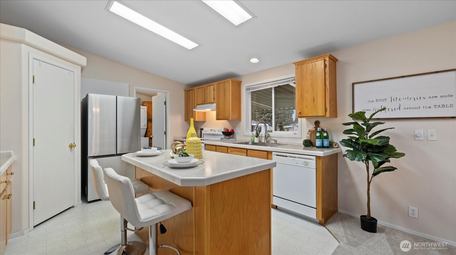 23825 15th Avenue Southeast, Unit 1 Bothell, WA 98021 - Photo 5 of 25 a kitchen with sink refrigerator and microwave