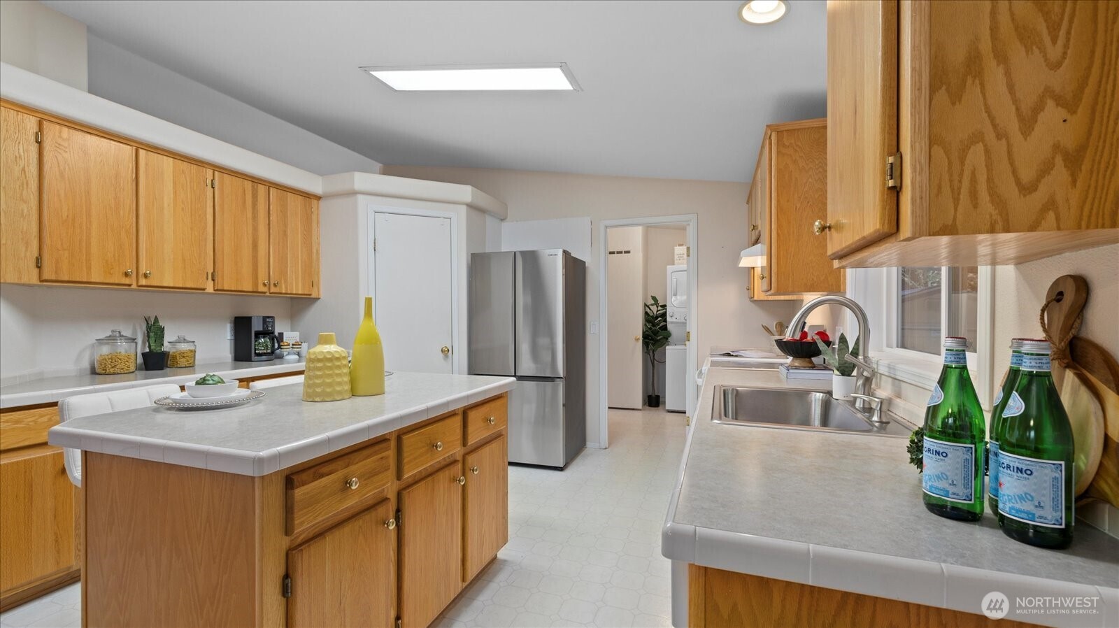 23825 15th Avenue Southeast, Unit 1 Bothell, WA 98021 - Photo 6 of 25 a view of a kitchen with fridge and wooden floor