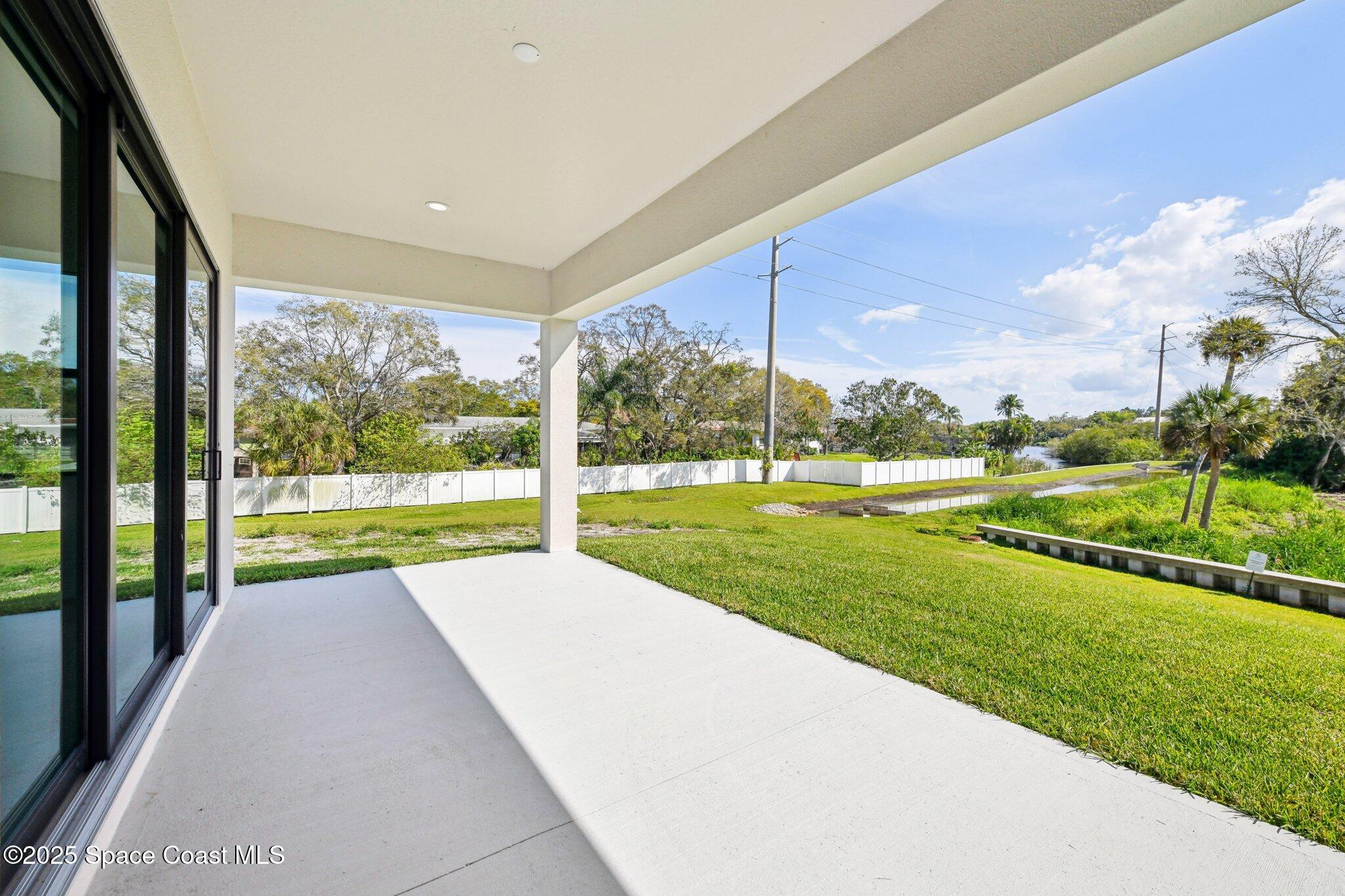 1405 Windchime Lane Melbourne, FL 32935 - Photo 14 of 48 a view of swimming pool from a big yard