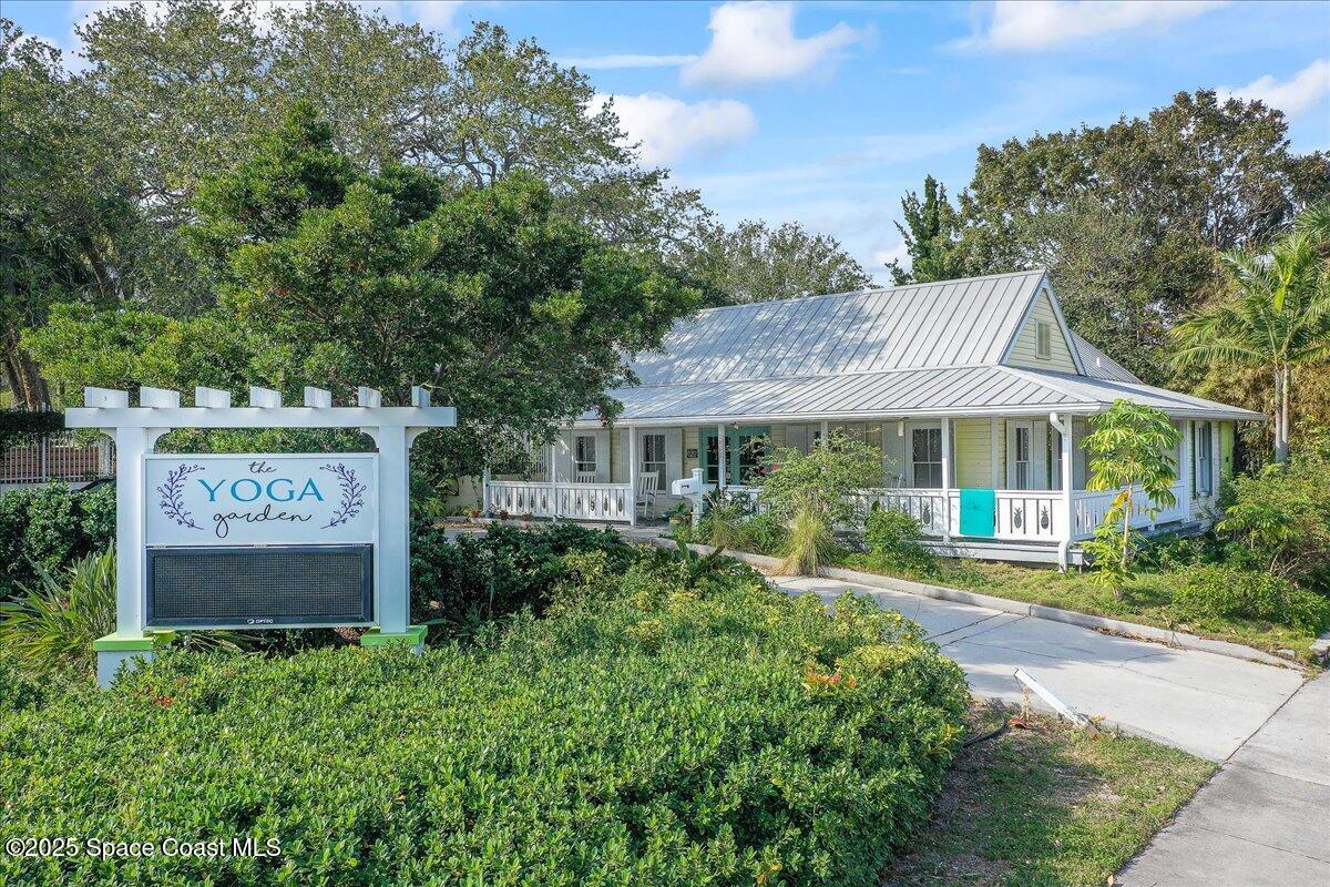1405 Windchime Lane Melbourne, FL 32935 - Photo 42 of 48 a view of a house with a yard and sitting area