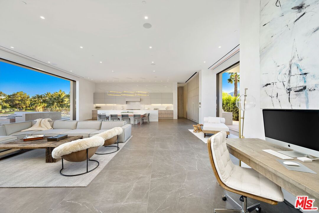 53804 Ross Avenue La Quinta, CA 92253 - Photo 12 of 29 a living room with furniture a window and a flat screen tv