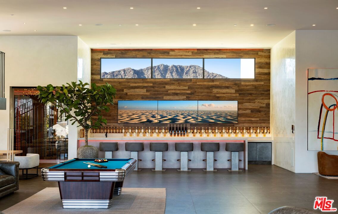 53804 Ross Avenue La Quinta, CA 92253 - Photo 15 of 29 a living room with furniture and a potted plant