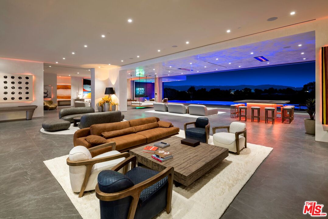 53804 Ross Avenue La Quinta, CA 92253 - Photo 18 of 29 a living room with furniture and a flat screen tv