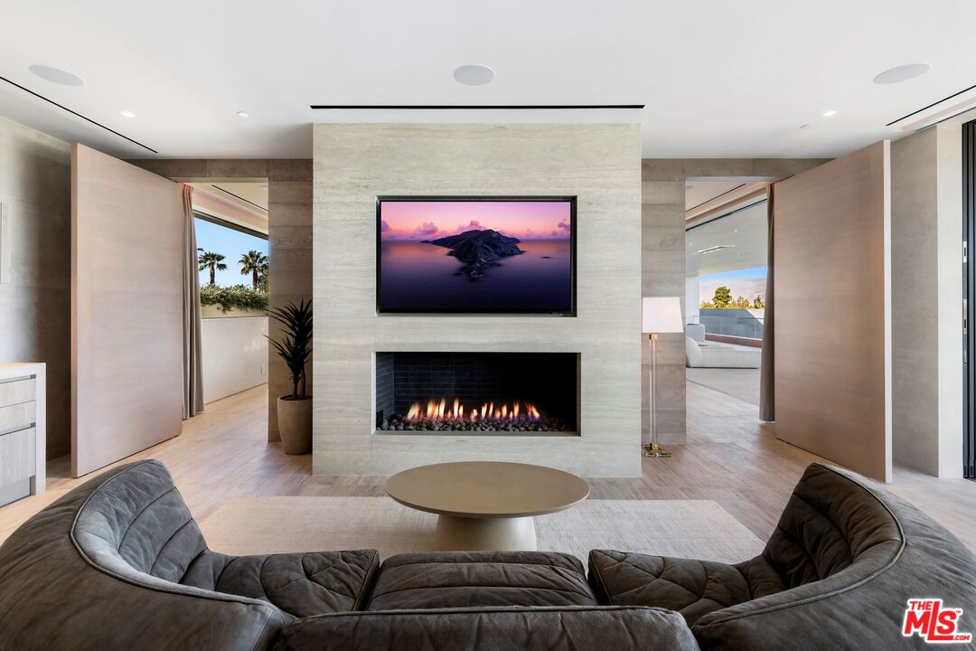 53804 Ross Avenue La Quinta, CA 92253 - Photo 24 of 29 a living room with furniture and a fireplace