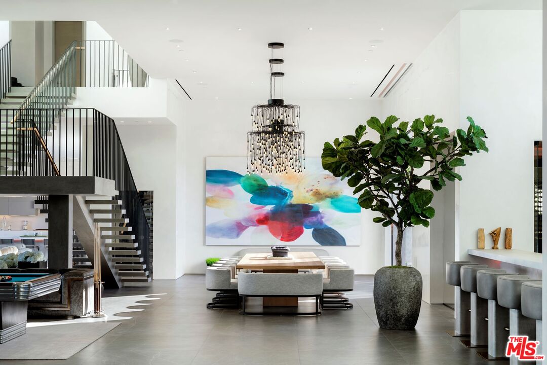 53804 Ross Avenue La Quinta, CA 92253 - Photo 6 of 29 a living room with furniture a chandelier and a potted plant