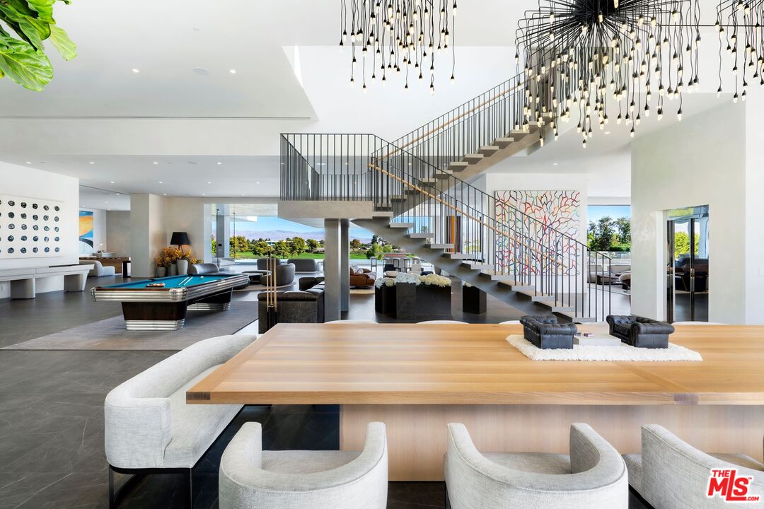 53804 Ross Avenue La Quinta, CA 92253 - Photo 7 of 29 a view of a dining room with furniture and a chandelier