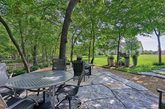 a view of a table and chairs in the patio