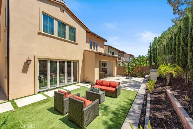 a view of a park with potted plants and large trees