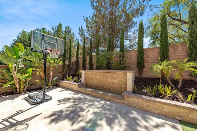 a view of a house with backyard porch and sitting area