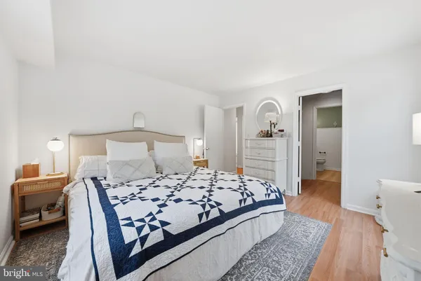 a view of walk in closet with clothes