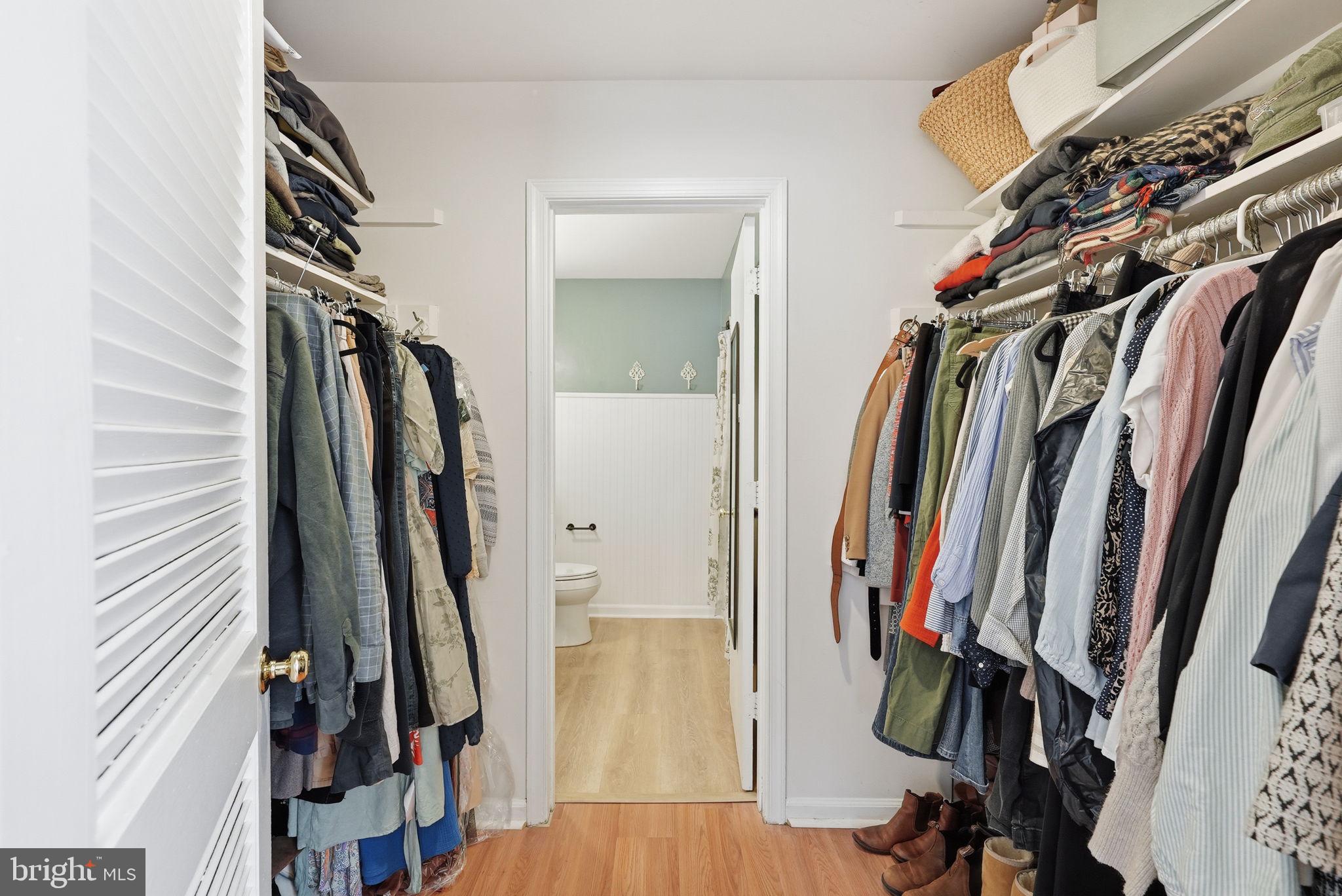 8231 Kings Charter Lane, Unit 108 Springfield, VA 22152 - Photo 19 of 37 a view of walk in closet with clothes and shoes