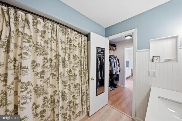 a bedroom with a bed and a table in it