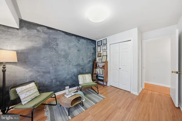 a room with furniture and a wooden floor