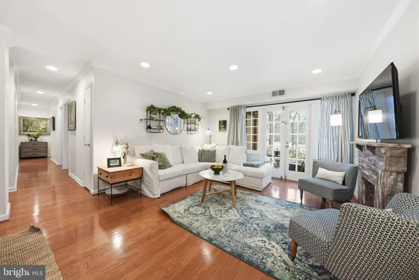 a living room with fireplace furniture and a flat screen tv