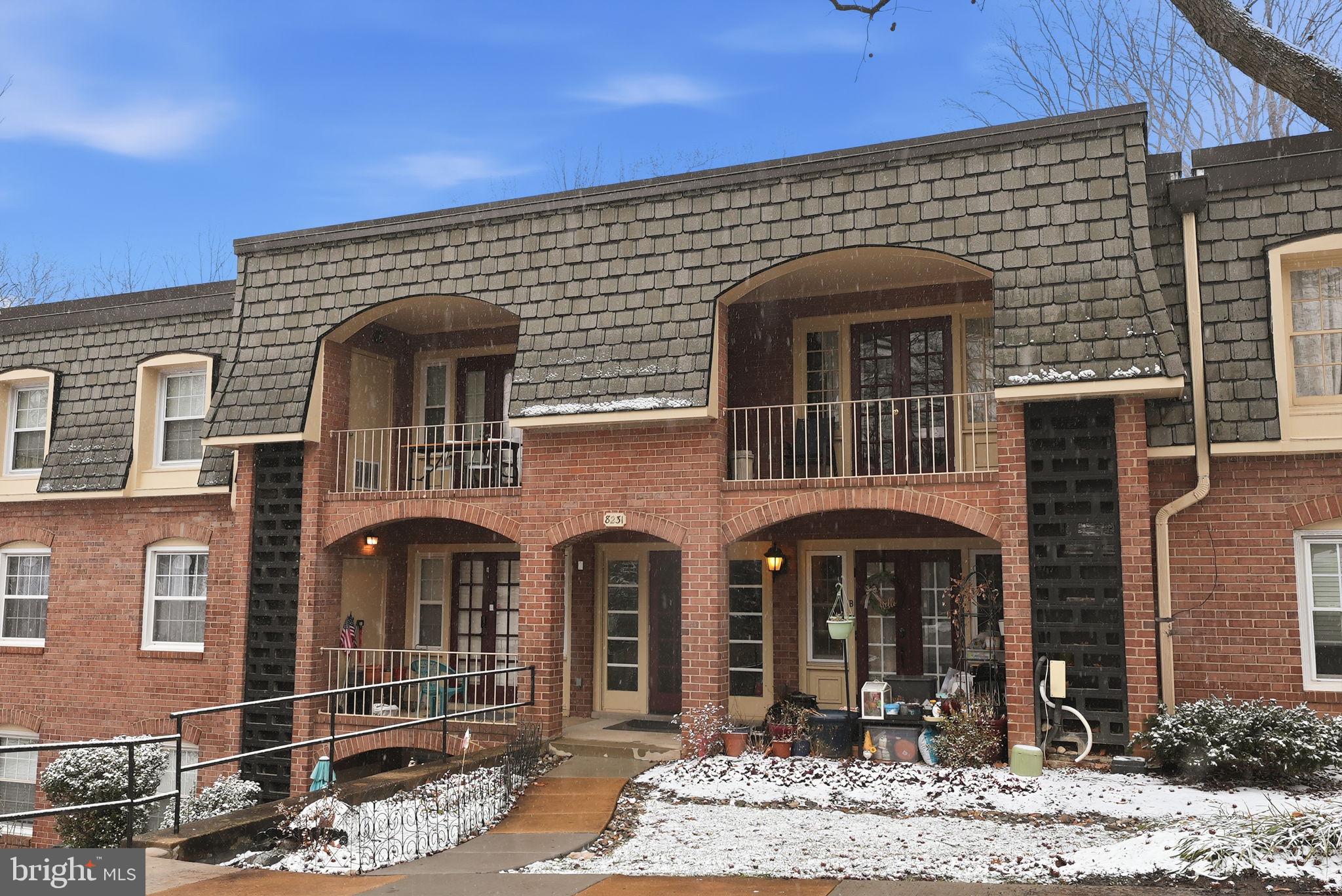 8231 Kings Charter Lane, Unit 108 Springfield, VA 22152 - Photo 33 of 37 a front view of a house with a yard