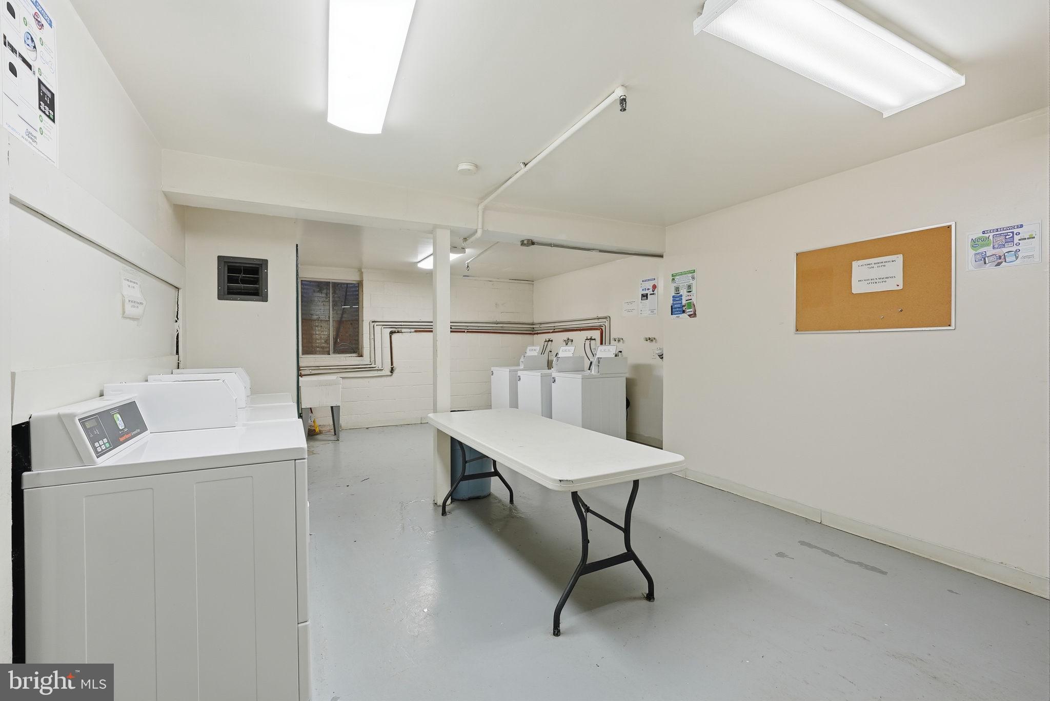 8231 Kings Charter Lane, Unit 108 Springfield, VA 22152 - Photo 34 of 37 a room with furniture and a wooden floor