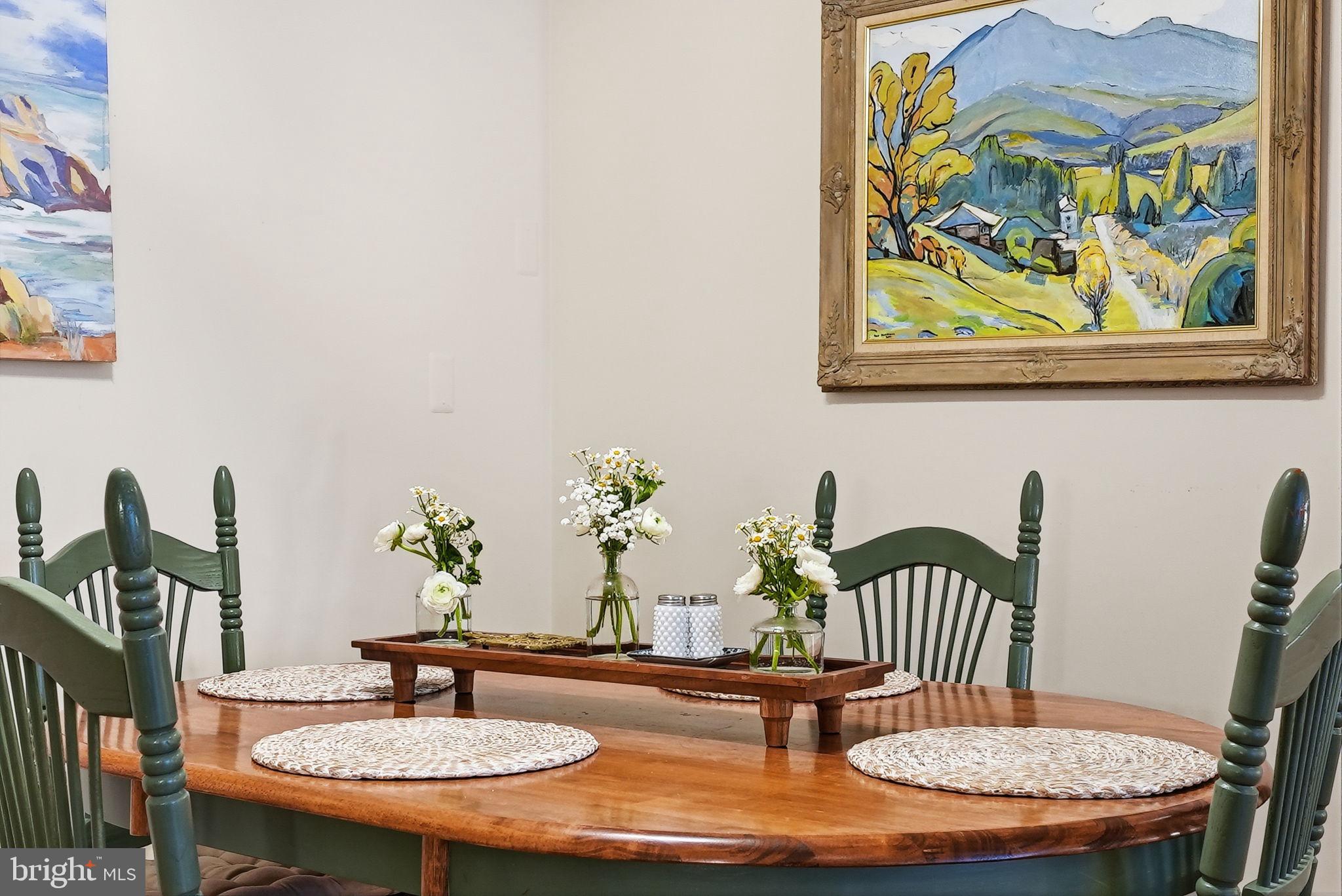 8231 Kings Charter Lane, Unit 108 Springfield, VA 22152 - Photo 9 of 37 a dining room with furniture and wooden floor
