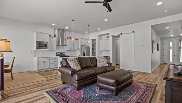 a living room with furniture and a rug