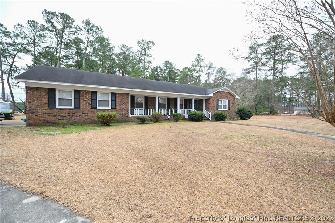 811 Butler Island Road Roseboro, NC 28382 - Photo 2 of 43 a front view of a house with a yard