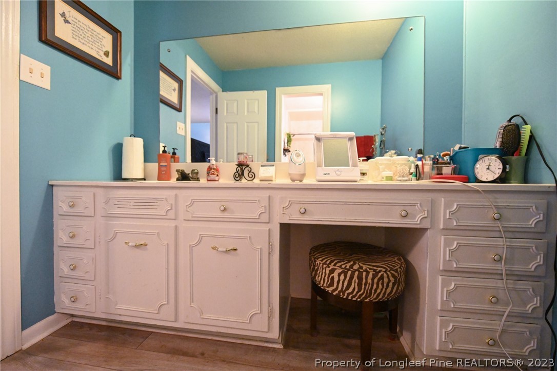 811 Butler Island Road Roseboro, NC 28382 - Photo 28 of 43 a kitchen with a cabinets and fireplace