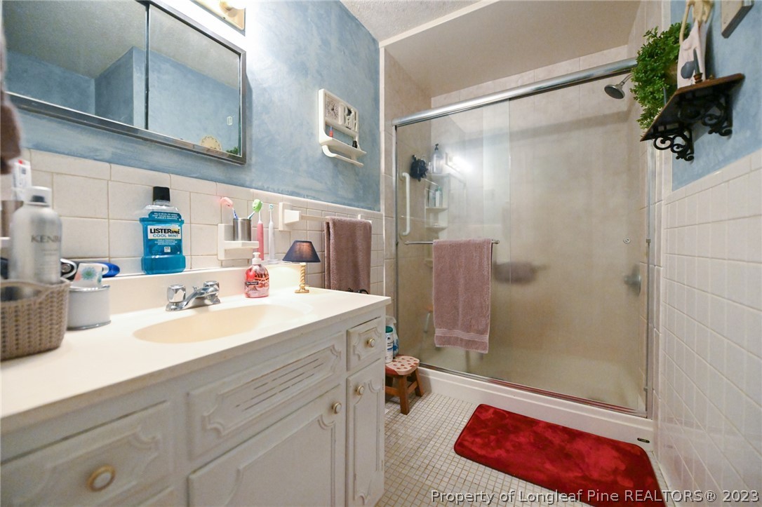 811 Butler Island Road Roseboro, NC 28382 - Photo 36 of 43 a bathroom with a sink and a mirror