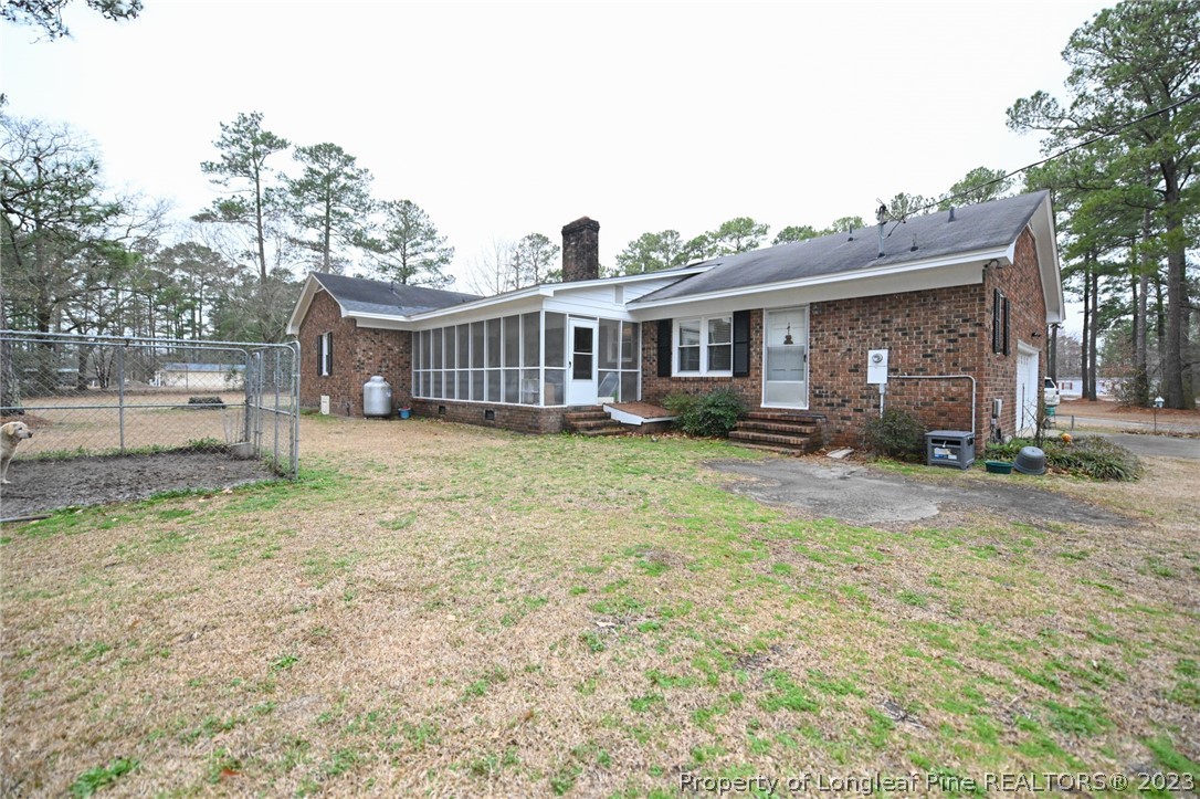 811 Butler Island Road Roseboro, NC 28382 - Photo 40 of 43 a front view of a house with a garden and plants