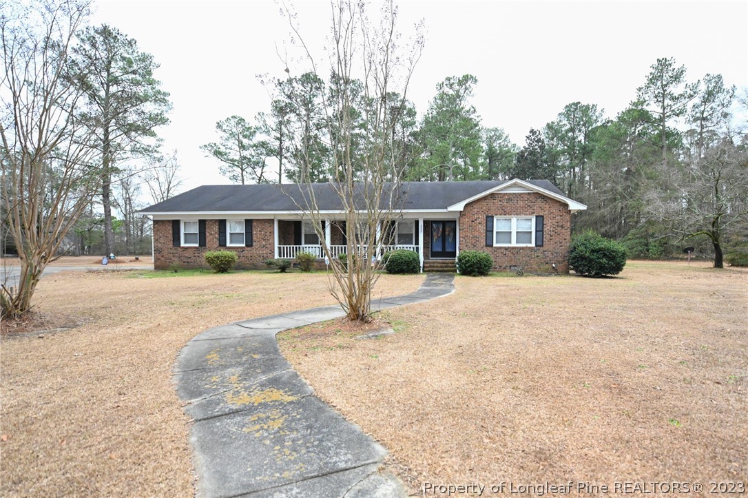 811 Butler Island Road Roseboro, NC 28382 - Photo 43 of 43 a front view of a house with a yard and garage