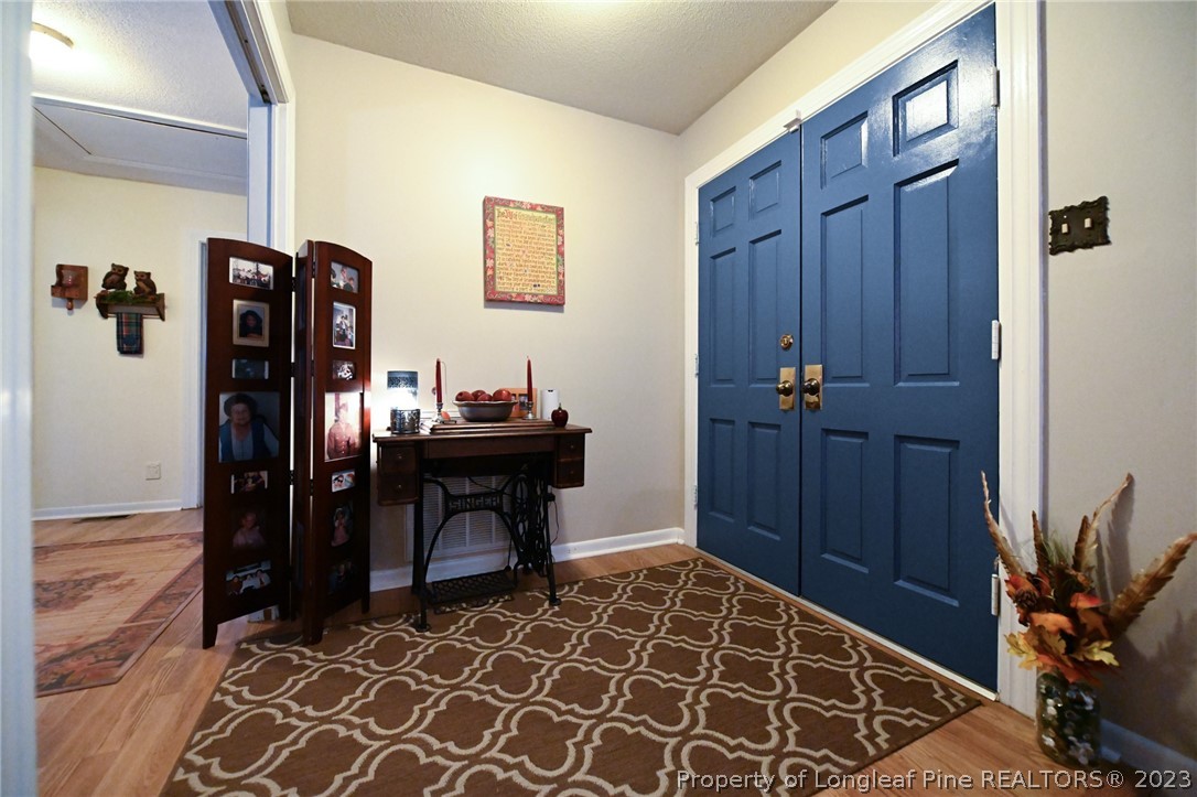 811 Butler Island Road Roseboro, NC 28382 - Photo 5 of 43 a area with table and closet