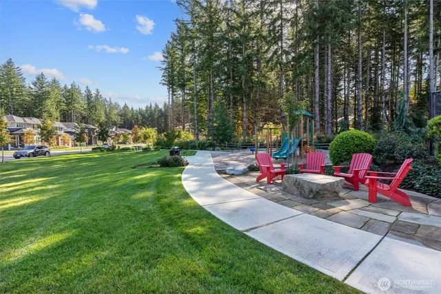 a view of a backyard with sitting area and furniture