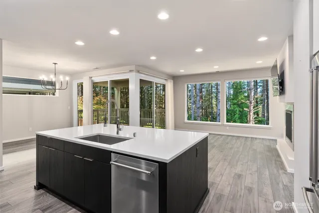 a kitchen with a sink and large window