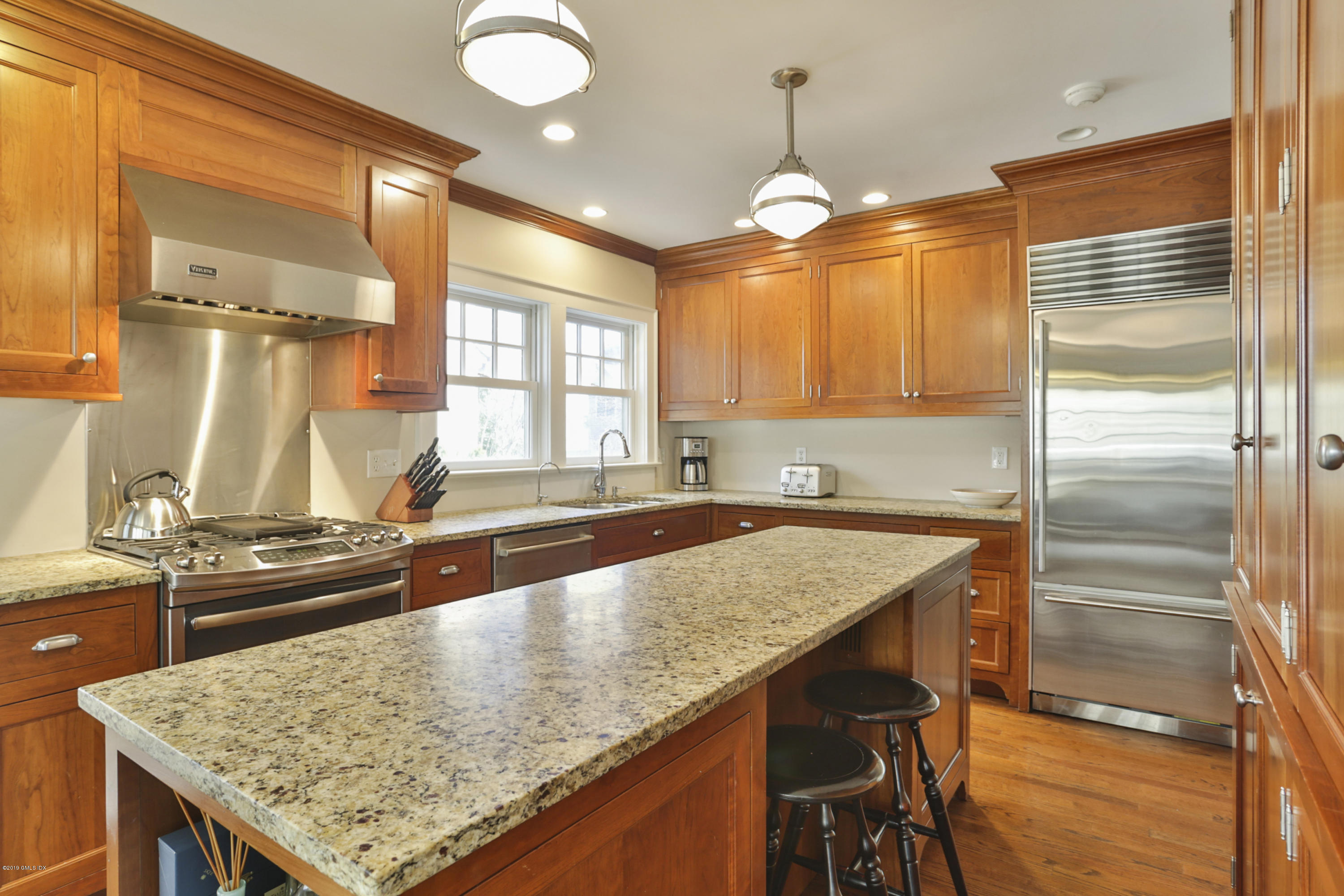 36 Valleywood Road Cos Cob, CT 06830 - Photo 12 of 45 a kitchen with stainless steel appliances granite countertop wooden cabinets window and a counter space