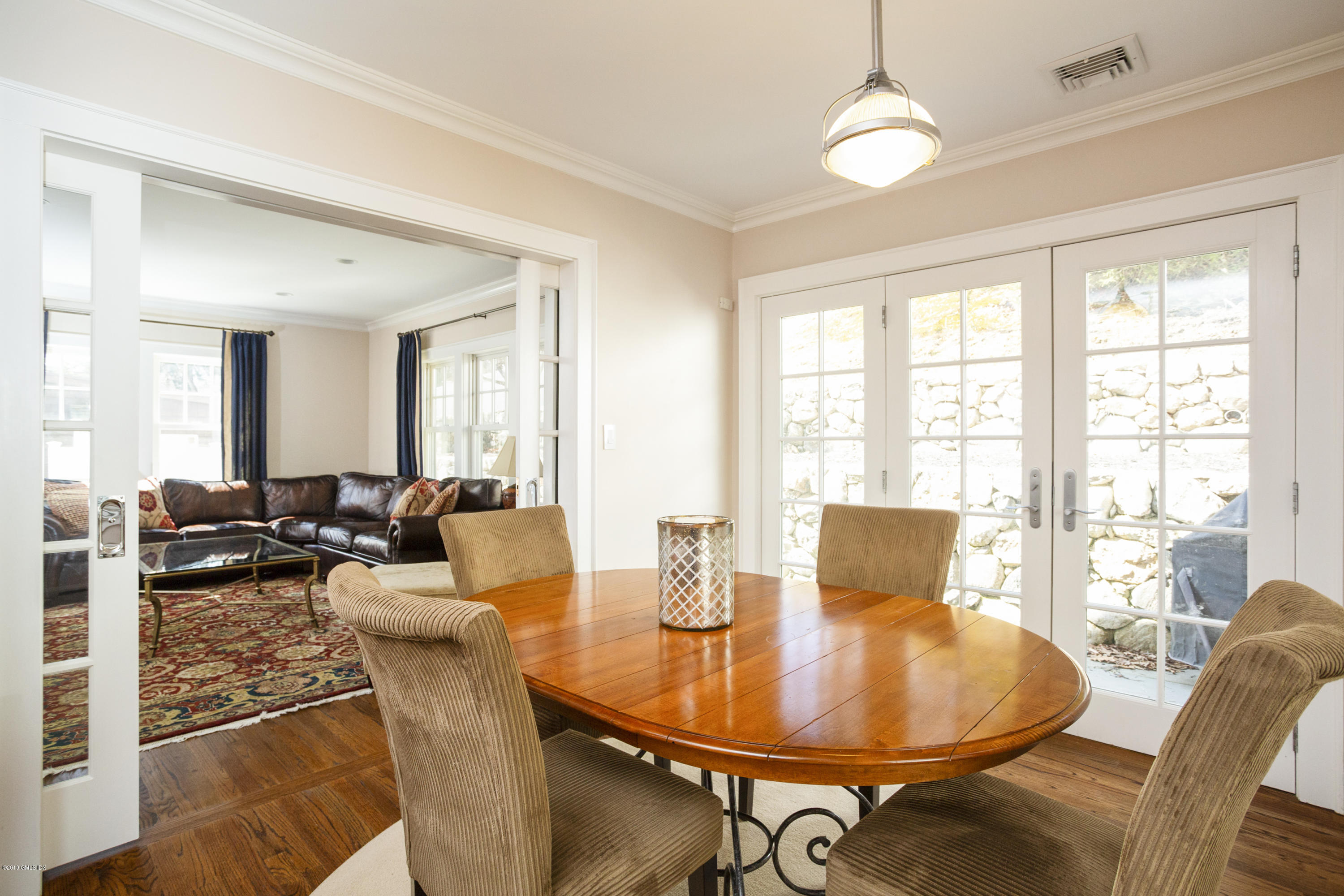 36 Valleywood Road Cos Cob, CT 06830 - Photo 15 of 45 a living room with furniture and a chandelier
