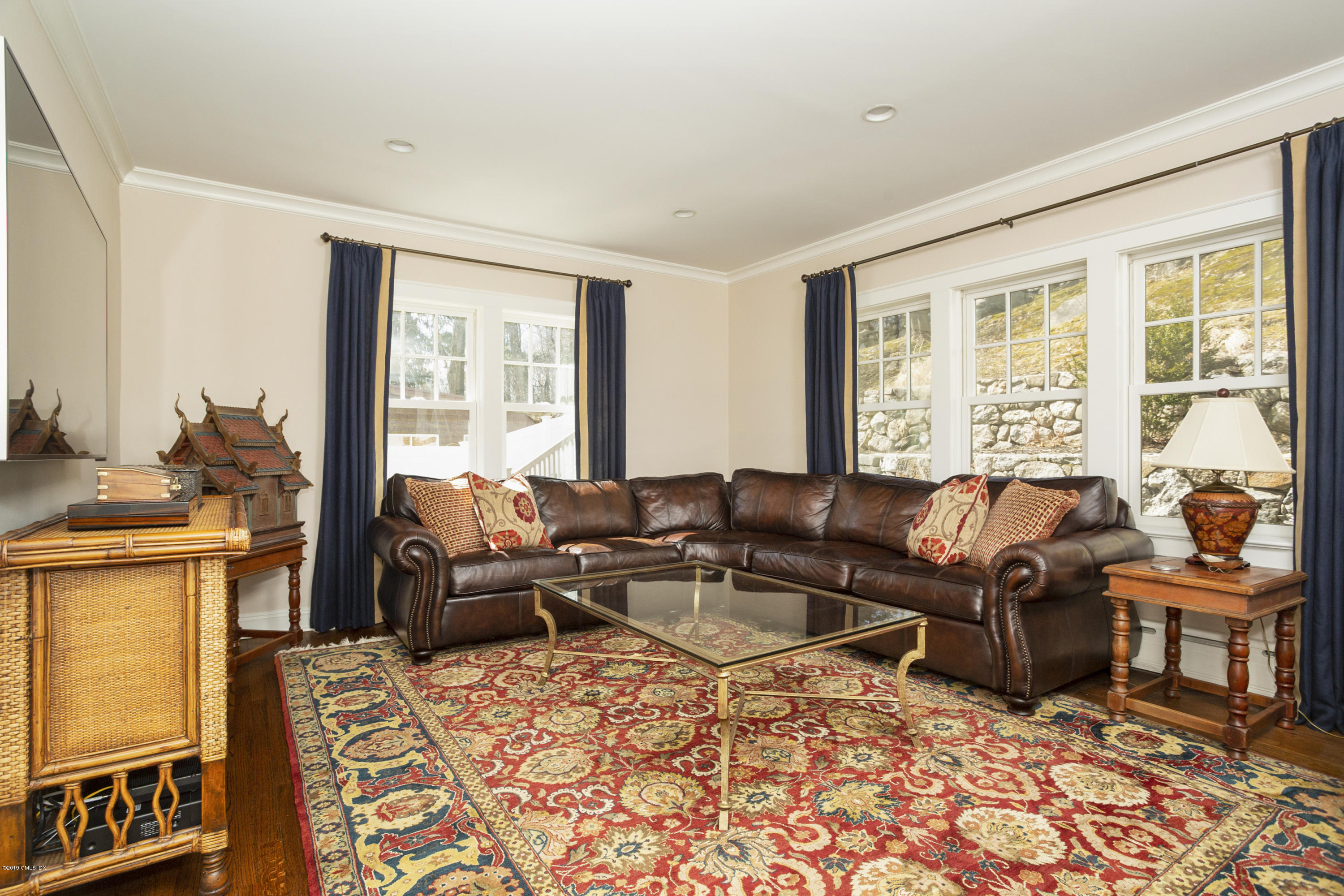 36 Valleywood Road Cos Cob, CT 06830 - Photo 18 of 45 a living room with furniture and a window