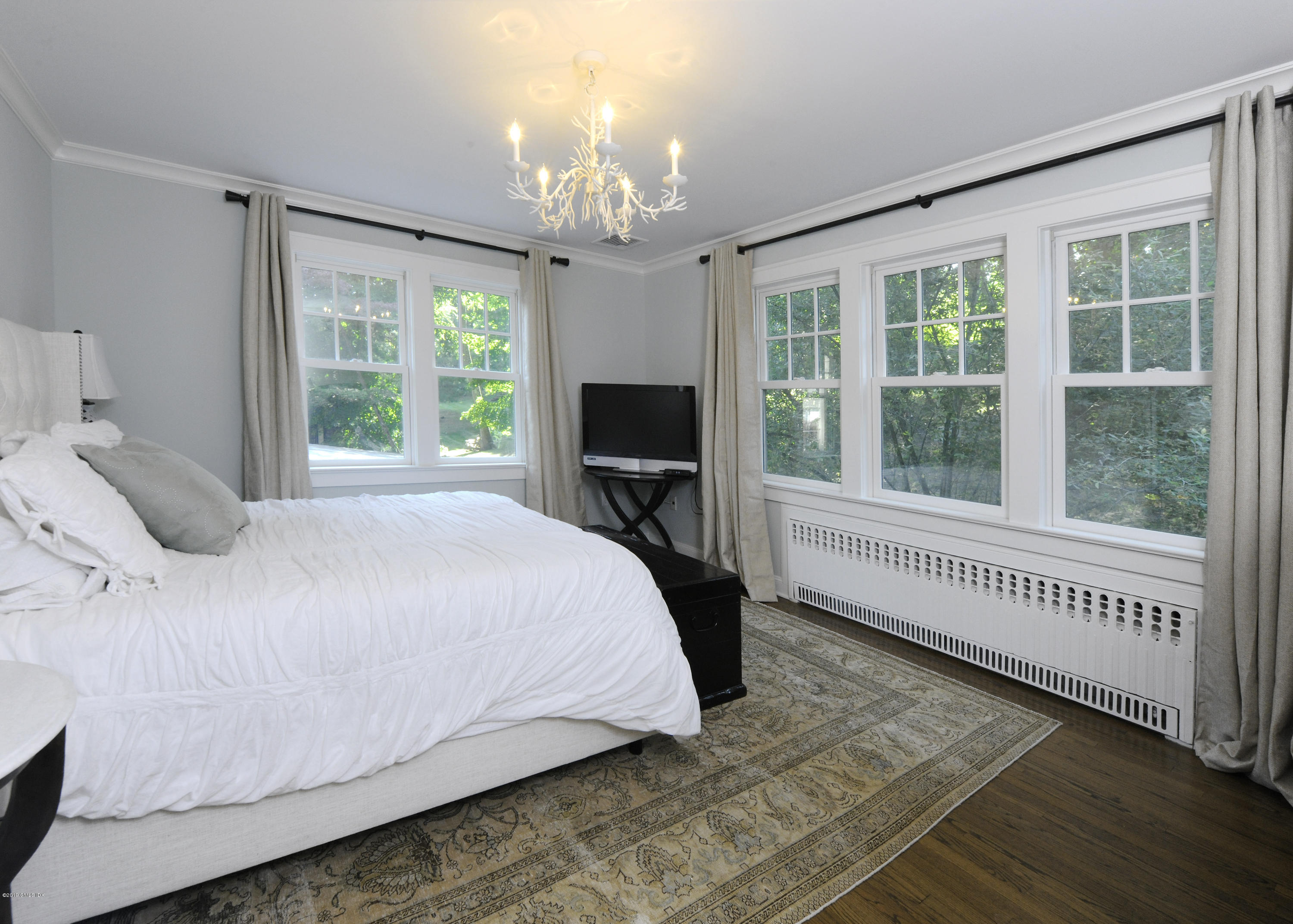36 Valleywood Road Cos Cob, CT 06830 - Photo 21 of 45 a bedroom with a bed and a window