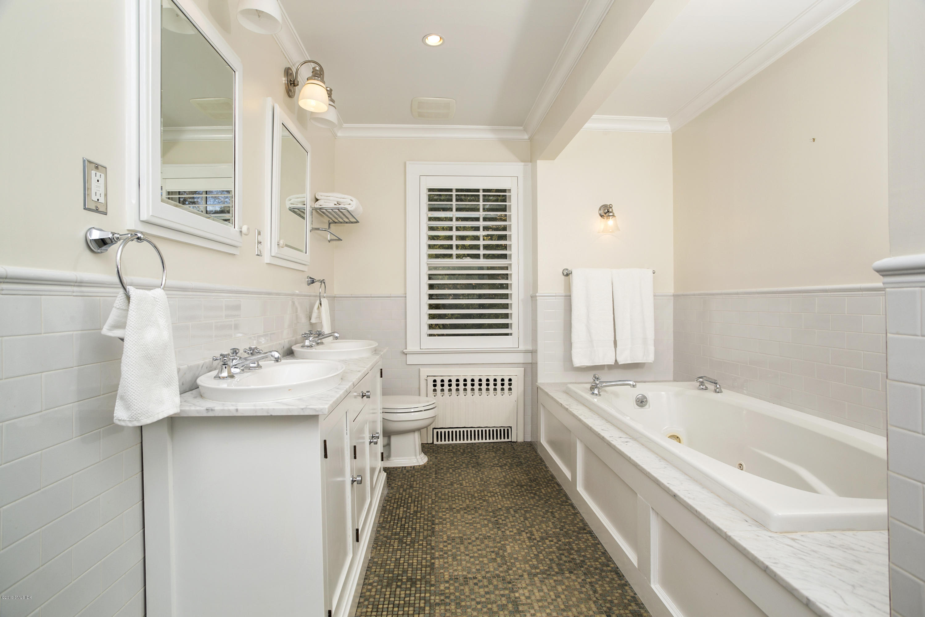36 Valleywood Road Cos Cob, CT 06830 - Photo 22 of 45 a bathroom with a tub sink and mirror