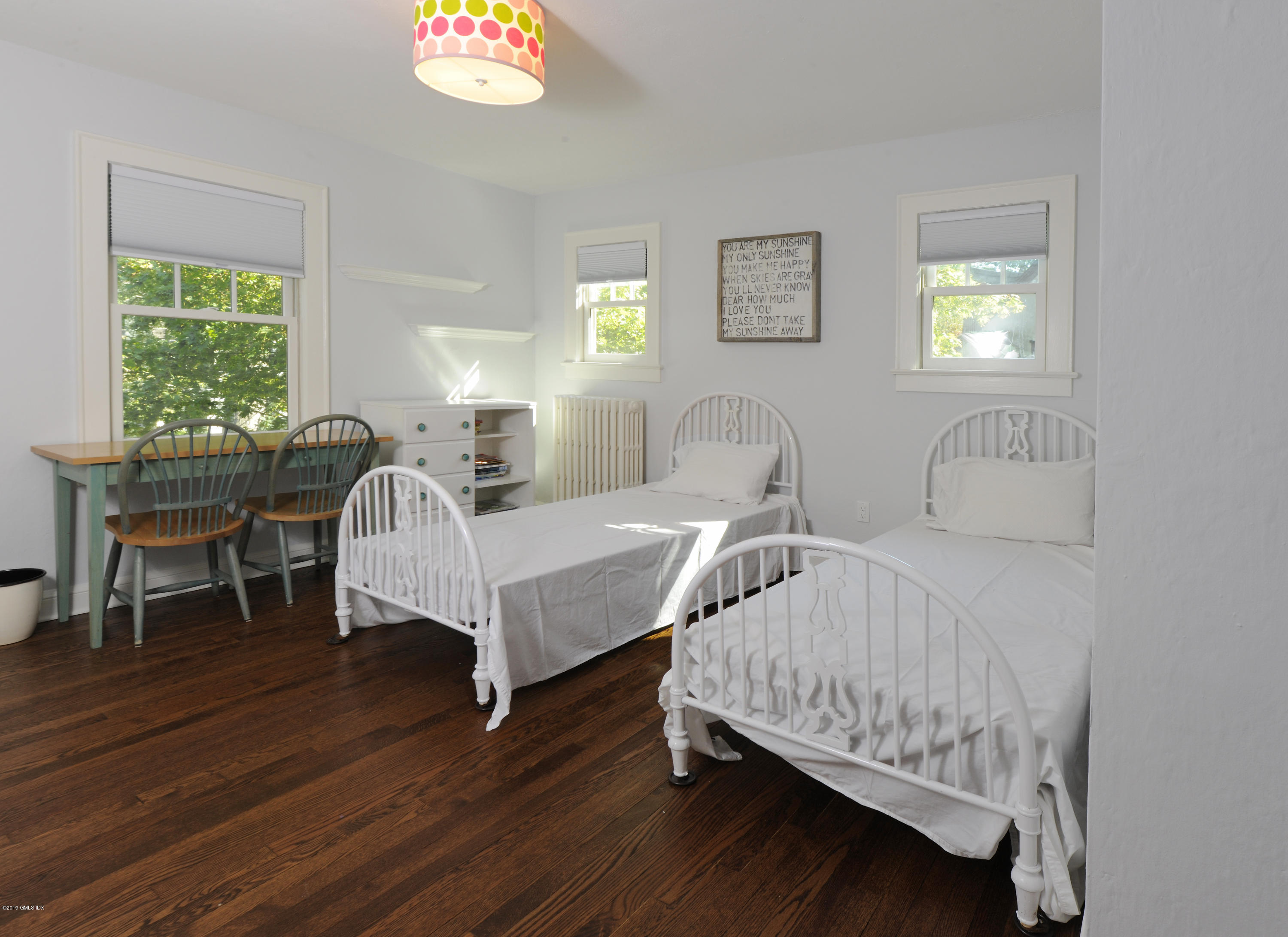 36 Valleywood Road Cos Cob, CT 06830 - Photo 25 of 45 a bedroom with two beds and a table