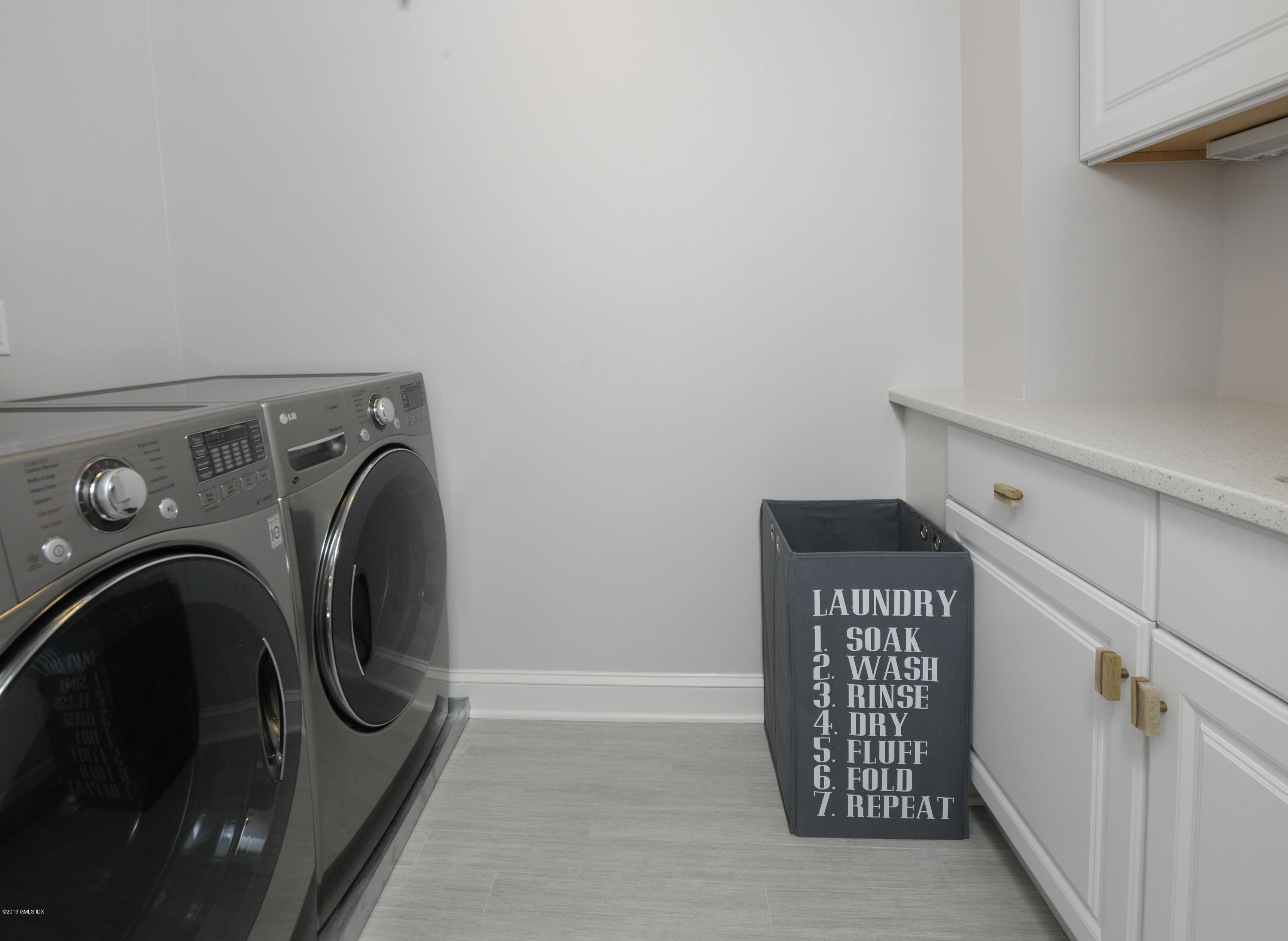 36 Valleywood Road Cos Cob, CT 06830 - Photo 27 of 45 a utility room with dryer and washer