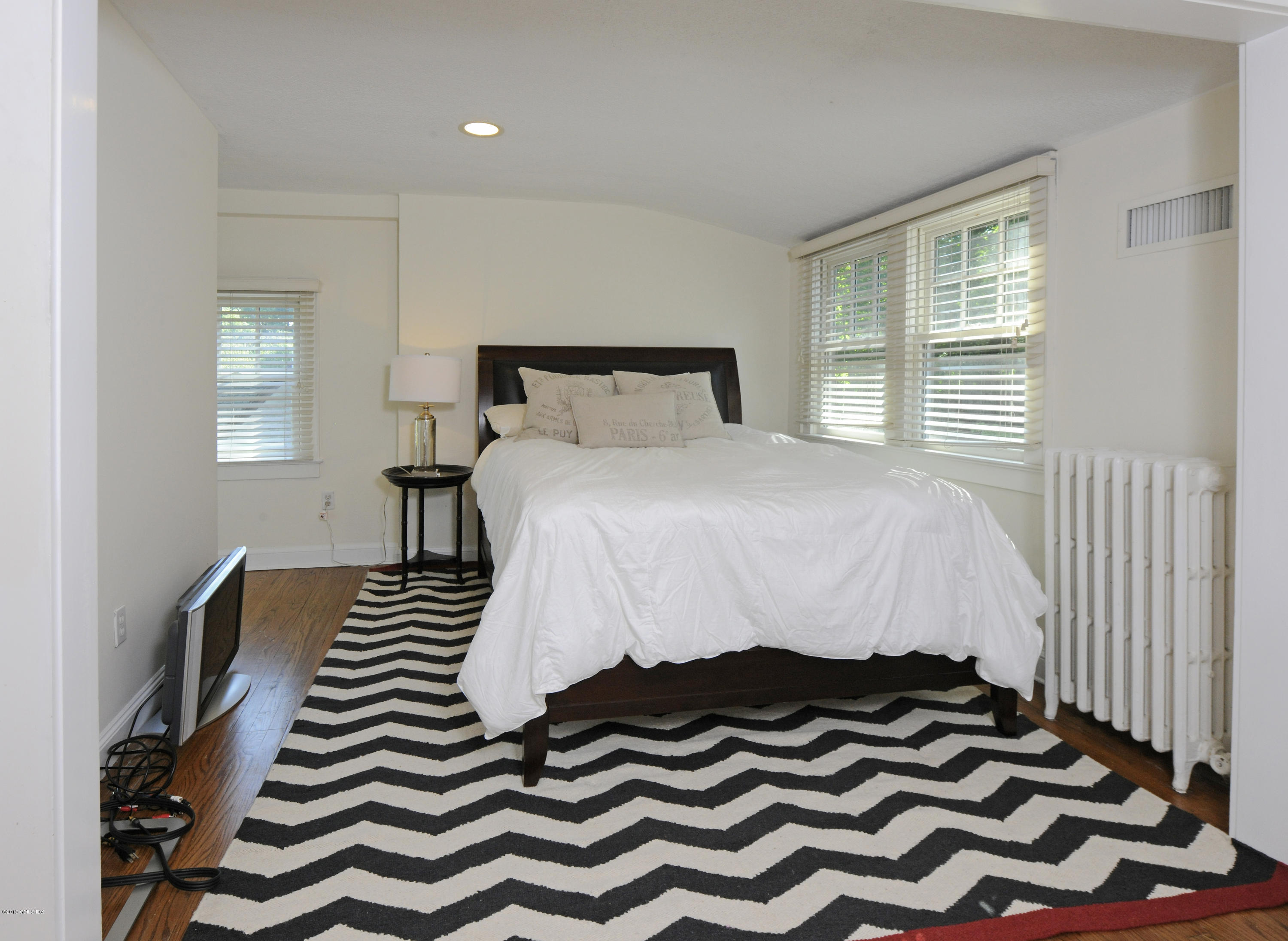 36 Valleywood Road Cos Cob, CT 06830 - Photo 31 of 45 a bedroom with a bed and a window